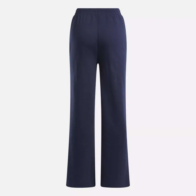 Pantalones anchos de felpa con pequeño logotipo Reebok Identity para mujer