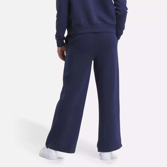 Pantalones anchos de felpa con pequeño logotipo Reebok Identity para mujer