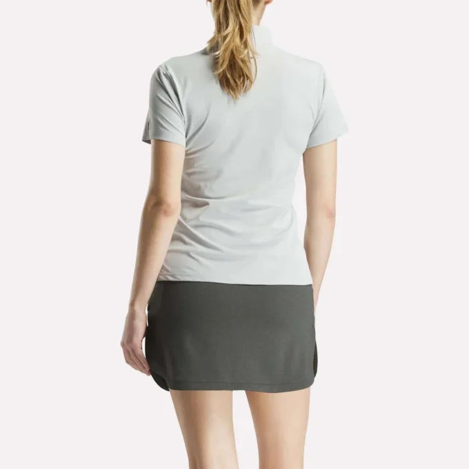 Polo de manga corta con tapeta de piqué elástico para mujer